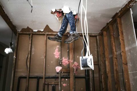 A man hanging inside the floor