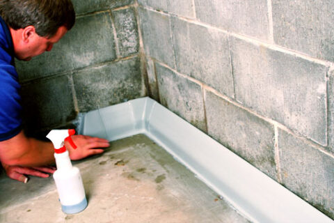 Man applying waterproofing foundation