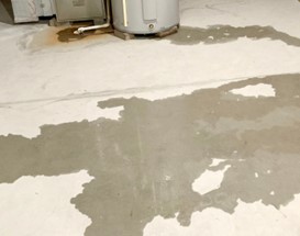 Moisture on a concrete floor in a Milwaukee, WI basement