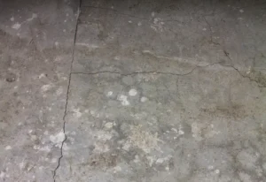 A cracked concrete basement floor in a Milwaukee, WI area home